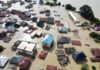 Flash Flood Carnage Hits College Town Aerial view of flooded residential neighborhood