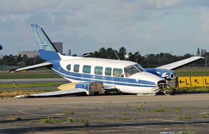 Turboprop,Abandoned,After,Crash,Landing Damaged blue and white small airplane on an airport runway