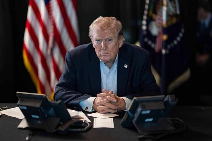 President,Donald,J.,Trump,Oversees,Operation,Epic,Fury,At,Mar-a-lago, Donald Trump seated at a table between two desk phones