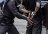 Crowd Panic As Armed Man Charges Police officer handcuffing a person against a vehicle