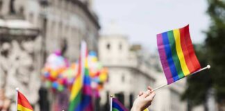 Pride flags waved at a city parade