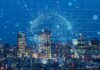Is The Internet’s Plumbing About To Burst? City skyline at night with digital network overlay