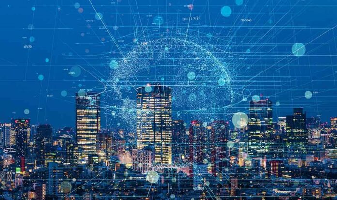 shutterstock_1025003299 City skyline at night with digital network overlay