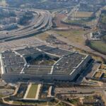 120 Days: Pentagon Bets on Musk The Pentagon aerial view with surrounding highways and parking lots