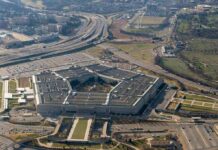 120 Days: Pentagon Bets on Musk The Pentagon aerial view with surrounding highways and parking lots
