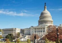 United States Capitol building with dome and autumn trees