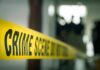 Nightmare on Perry Street – 9 Lives Ended crime scene tape in a blurred indoor setting
