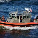 Gunfire Erupts Across Rio Grande U.S. Coast Guard patrol boat speeding on open water