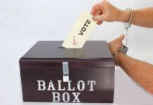 Election Frenzy Erupts — HISTORICAL Turnout Hand in handcuffs casting a vote into a ballot box