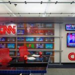France Riots Spark CNN Brawl CNN newsroom set with red chairs and multiple TVs