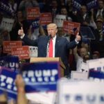 House In Play – Trump Raises Stakes Donald Trump speaks at a rally, giving two thumbs up