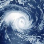 Category 3 Beast Zeroes In Hurricane swirling over the ocean from above