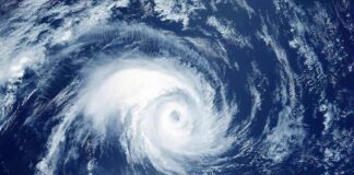 Hurricane swirling over the ocean from above