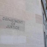 Citizens Pay More, Illegals Pay Less? Department of Justice building exterior with American flags