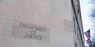 Department of Justice building exterior with American flags