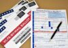 Judges Rewrite Abortion Battle Lines Vote-by-mail ballot envelopes and application form with pen
