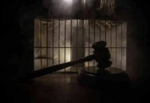Execution Fails – Panic In Death Row Judge’s gavel in silhouette before prison bars