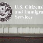 $70,000 Shock Hits Campuses USCIS building sign with DHS seal