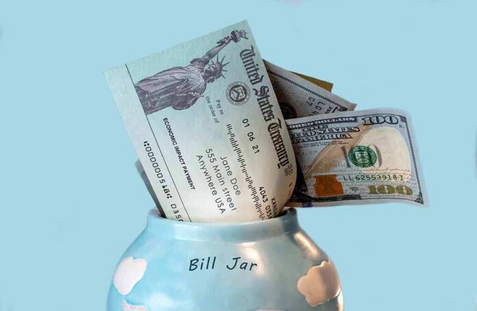Bill jar with U.S. Treasury check and cash sticking out