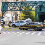 San Francisco Break-In Turns Deadly Close Police cars block a city intersection with yellow crime scene tape