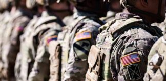 Soldiers in camouflage uniforms standing in formation