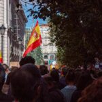 Snap Election After Housing Uproar Crowd with Spanish flags in a city street