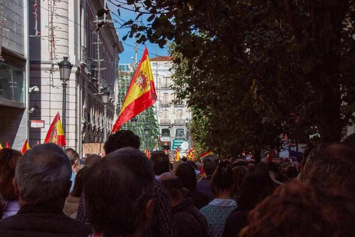 Crowd with Spanish flags in a city street